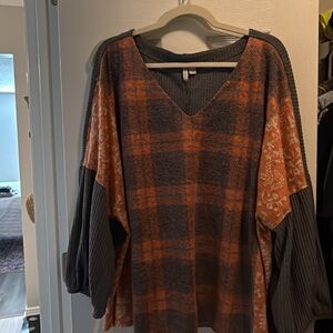 Plaid V-Neck Sweater with Orange and Gray Tones